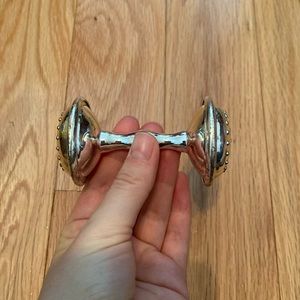 Silver baby rattle with cross